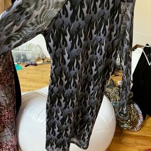 Black and ultraviolet flames cover this sheer near kneelength dress THUMBIES
